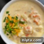 Top view of potato soup in white bowl