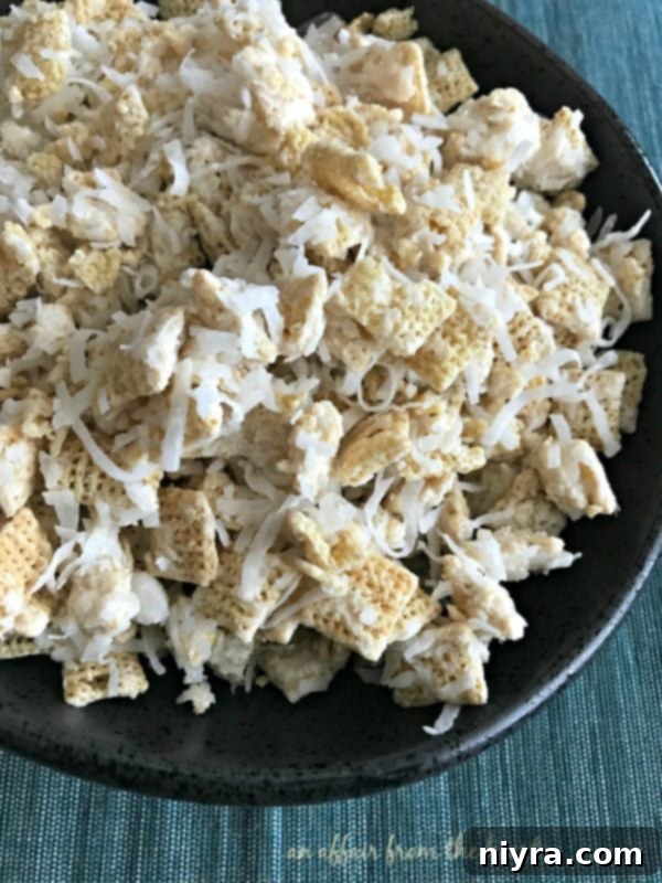 Close-up of Coconut Muddy Buddies with visible coconut flakes