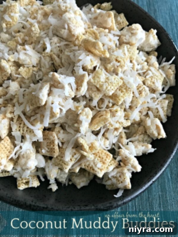 Freshly made Coconut Muddy Buddies cooling