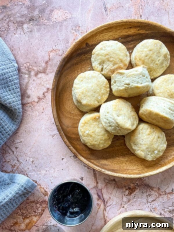 Fluffy Buttermilk Biscuits 2 Freshly baked old fashioned buttermilk biscuits on a baking sheet