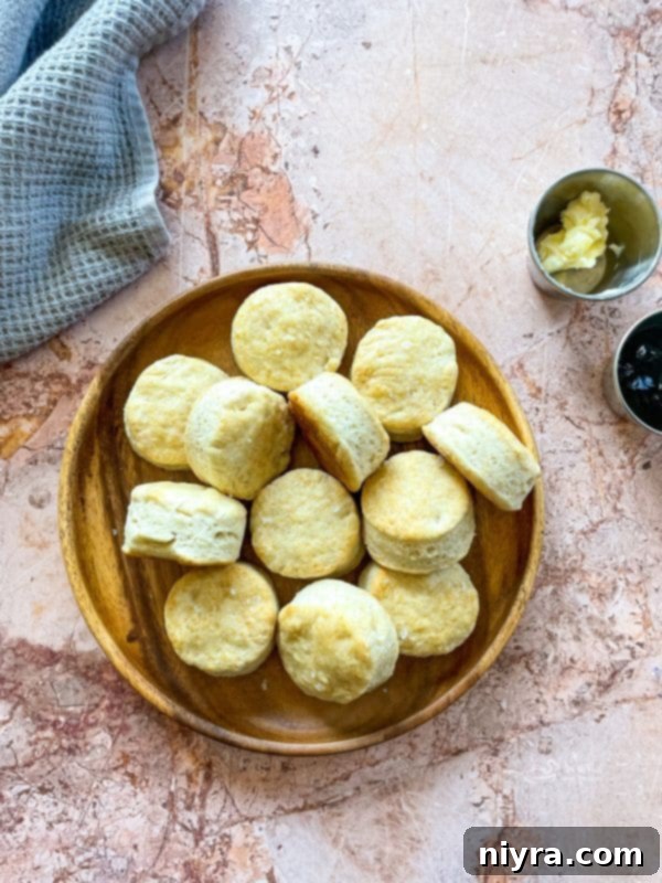 Fluffy Buttermilk Biscuits 15 Stack of golden brown buttermilk biscuits on a white plate