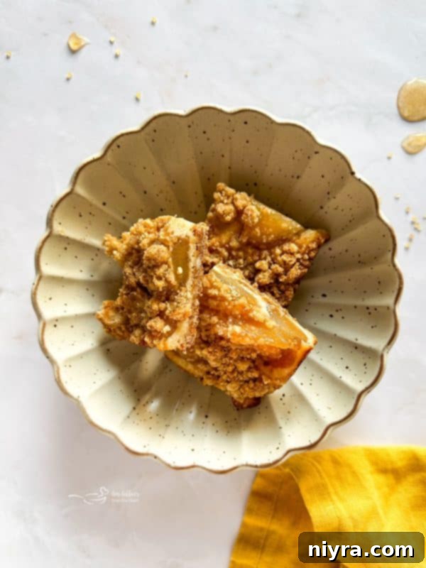 Close up of Apple Pie Crumb Bars in a baking dish