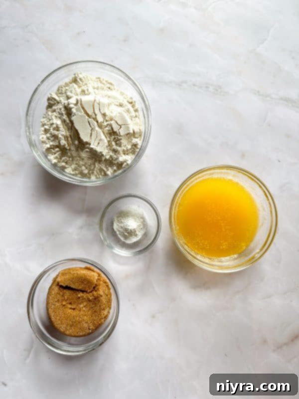 Apple Pie Crumb Bars on a serving tray, a few with a scoop of ice cream
