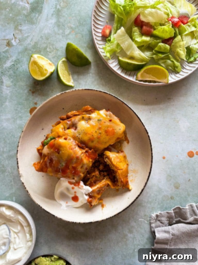 Delicious Slow Cooker Smothered Burritos, cooked to perfection and ready to serve.