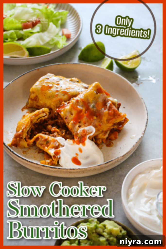 Overhead view of slow cooker smothered burritos in a serving dish.