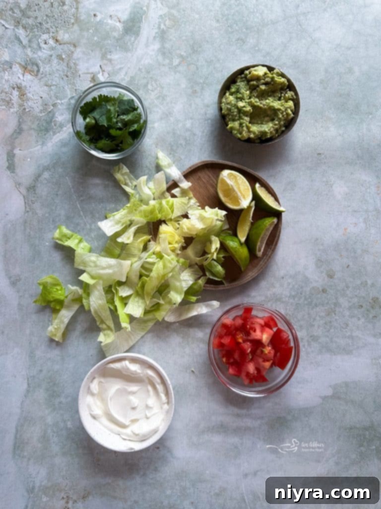 The three main ingredients for slow cooker smothered burritos: frozen burritos, enchilada sauce, and shredded cheese.