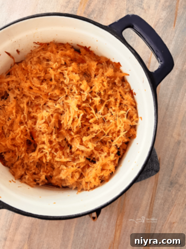 Frank's Sweet & Smoky BBQ Kraut poured over hot dogs