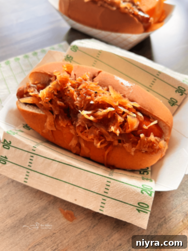 Baked BBQ Hot Dogs with Sauerkraut in Dutch oven