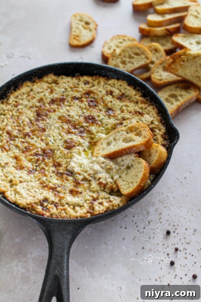 Golden-brown Baked Vidalia Onion Dip with toasted baguette slices