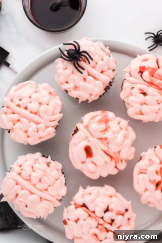 Side view of a Halloween Brain Cupcake with blood drizzle