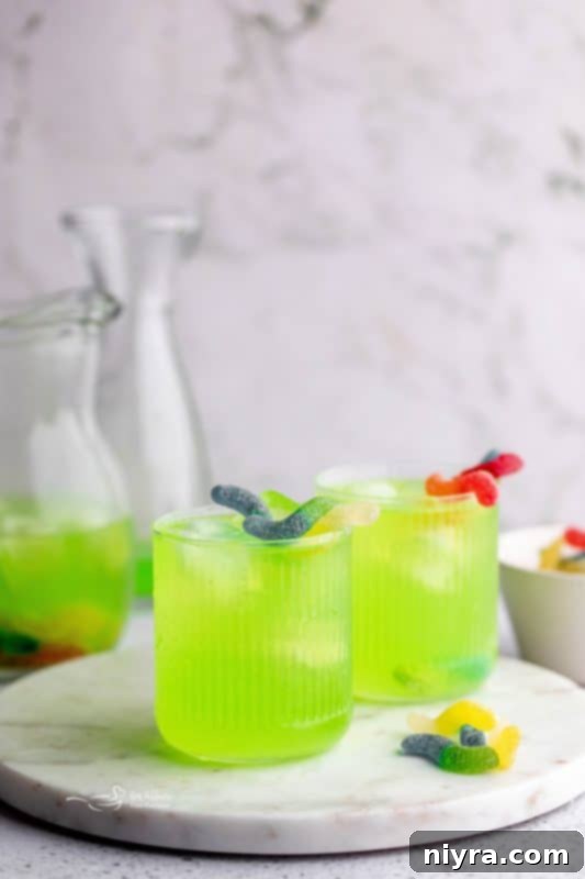 Step 5: Halloween Kids Punch served in glasses with ice and extra sour worms for decoration.