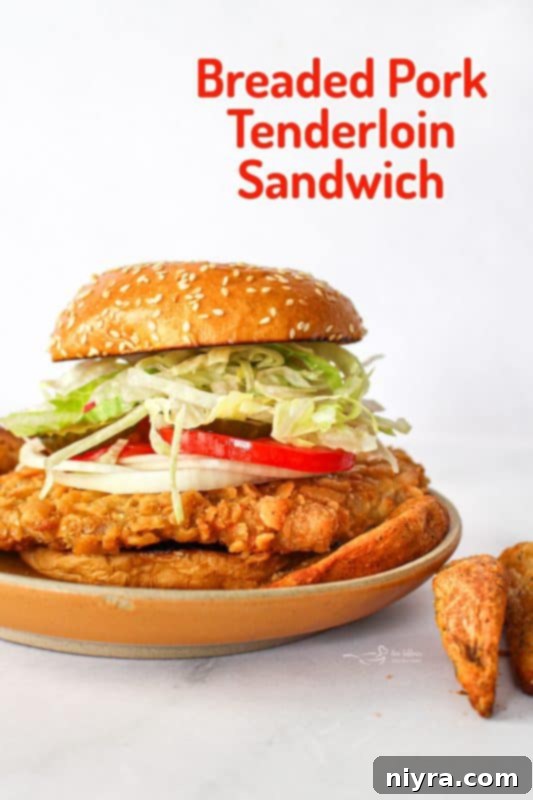 Crispy Pork Tenderloin Sandwich 18 Delicious Breaded Pork Tenderloin Sandwich on a plate with fries