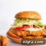 Crispy Pork Tenderloin Sandwich 19 Close up of Breaded Pork Tenderloin Sandwich