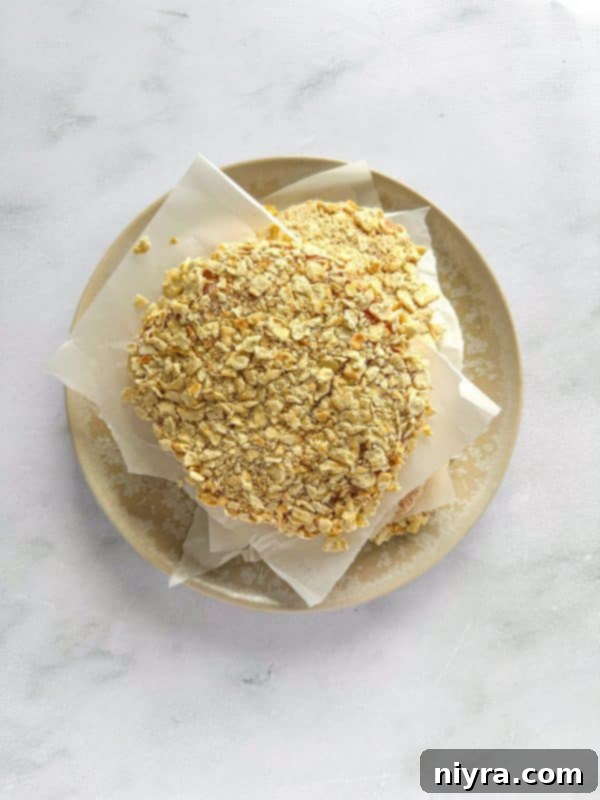 Crispy Pork Tenderloin Sandwich 10 Step-by-step: dipping pork chop in egg wash