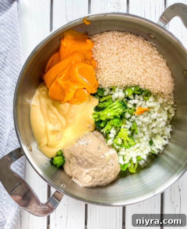 Broccoli, onion, rice, cream of chicken and mushroom, and Cheese Whiz in a large pot