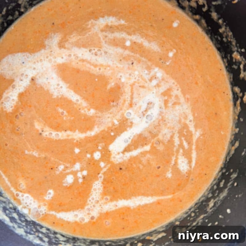 Step 8: Serving French Sauerkraut Soup with bratwurst slices and fresh parsley.