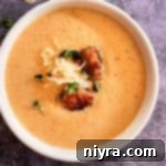 French Sauerkraut soup in a white bowl