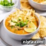 Overhead of Mexican Style Leftover Turkey Soup in a white bowl