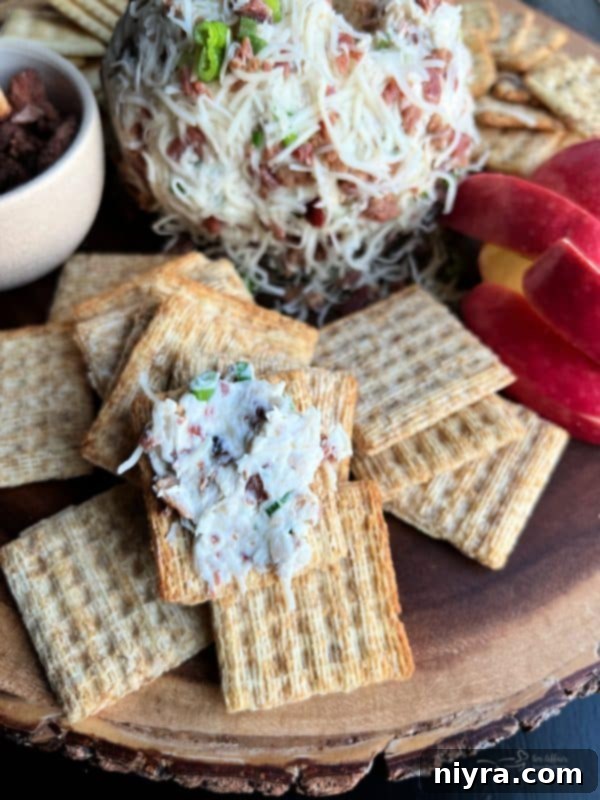 Close-up of the Sauerkraut Bacon & Swiss Cheese Ball with crackers