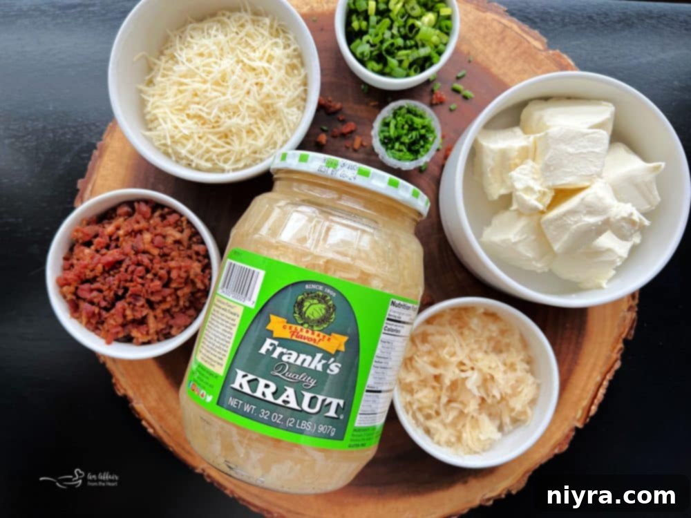 Sauerkraut Bacon & Swiss Cheese Ball on a wooden board with grapes and crackers