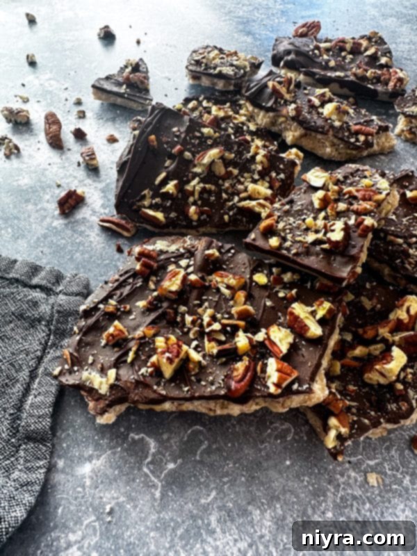 Close-up of golden homemade toffee with chocolate and nuts