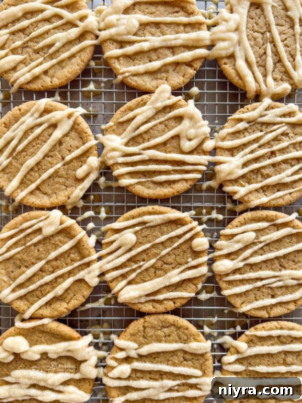 Golden Maple Delights 2 Close-up of Iced Maple Sugar Cookies on a cooling rack, showcasing the soft texture and maple glaze.