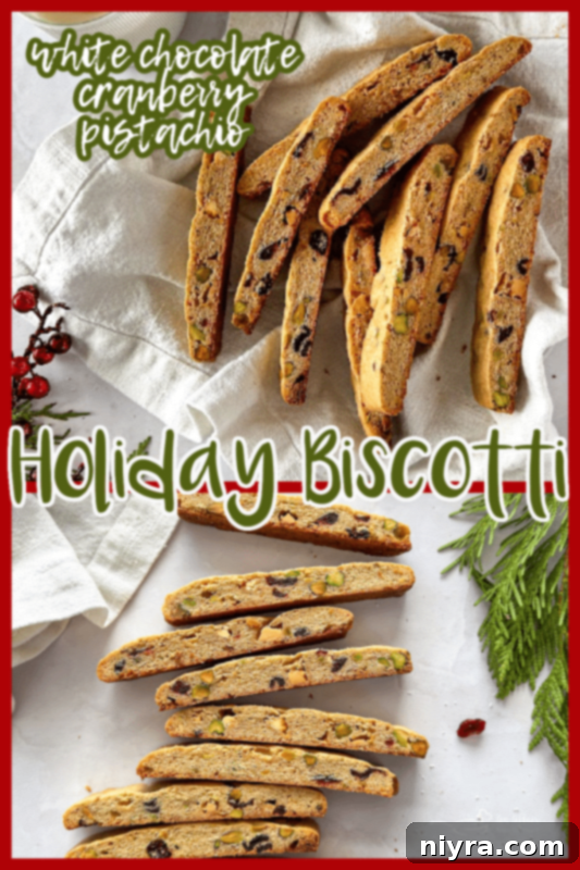 Festive Biscotti 12 Plate of finished Holiday Biscotti with white chocolate drizzle and pistachios.