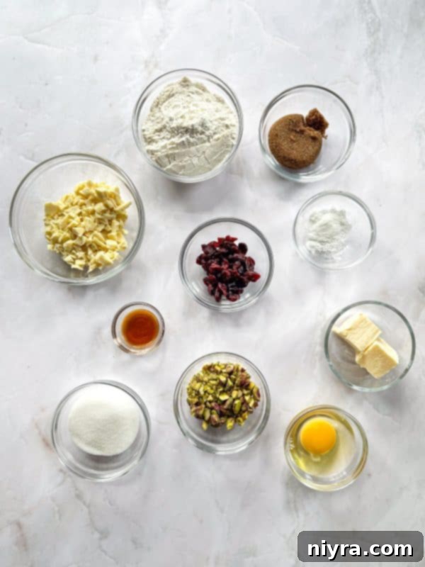 Festive Biscotti 5 Ingredients for biscotti laid out on a table: butter, sugar, eggs, flour, extracts, and mix-ins.