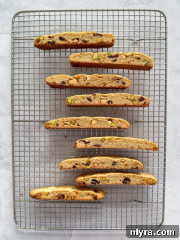 Festive Biscotti 10 Sliced biscotti pieces arranged on a baking sheet for their second bake.