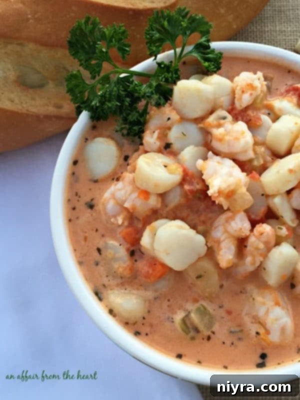 Creamy Tomato Seafood Bisque, a vibrant red soup.