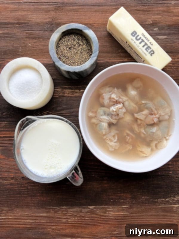 Oyster stew garnished with parsley in a rustic bowl.