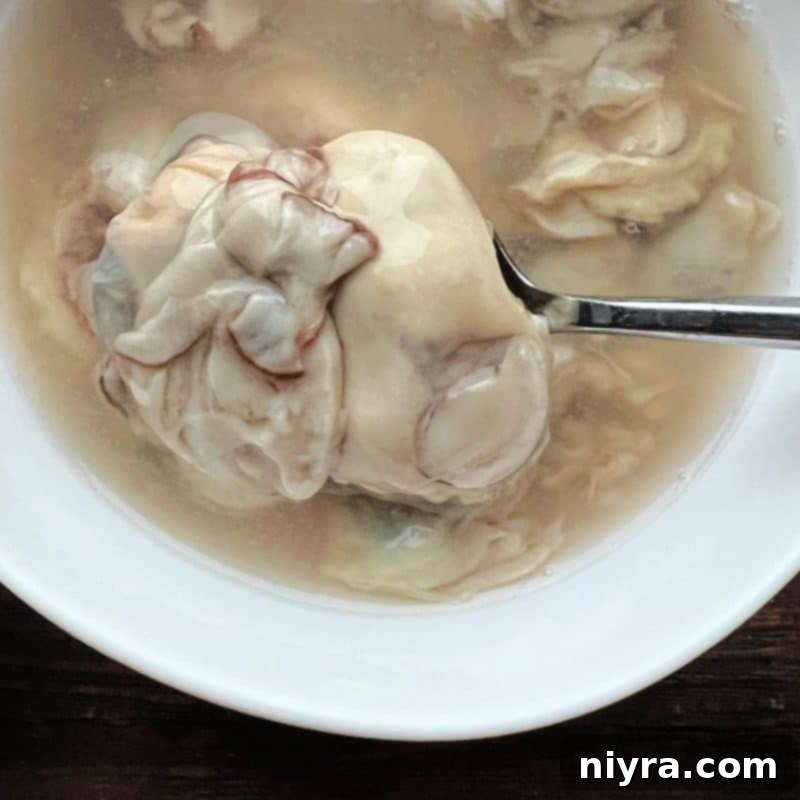 Fresh raw oysters and a stick of butter, key ingredients for oyster stew.
