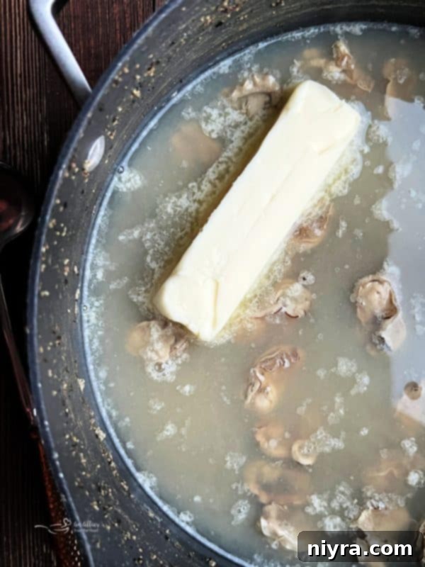 Adding a stick of butter to the oyster stew.