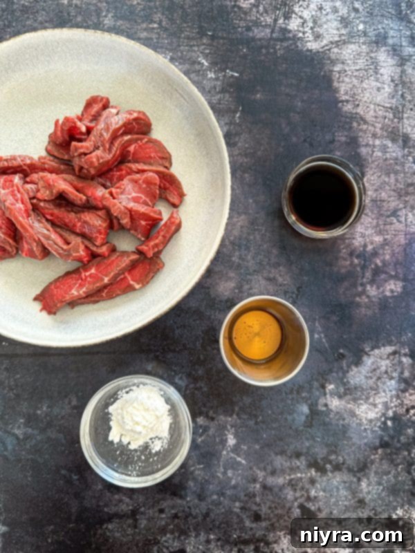 Close up shot of Beef Lo Mein showing noodles, beef, and colorful vegetables.