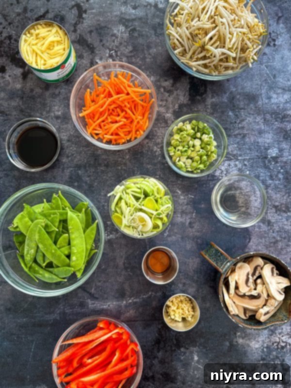 Ingredient preparation for Beef Lo Mein: sliced steak, cornstarch, and soy sauce.