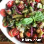 Overhead of Italian bean salad in a white bowl