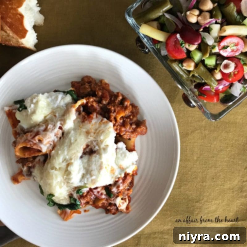 A complete meal featuring Skillet Lasagna served alongside the fresh Italian Bean Salad.