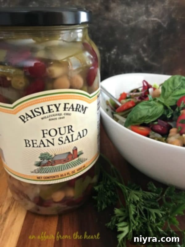 A close-up of the Italian Bean Salad, showcasing the fresh herbs and colorful vegetables.