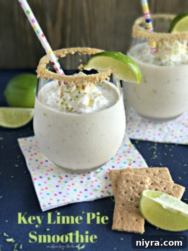 Key Lime Pie Smoothie in a tall glass with lime wedge
