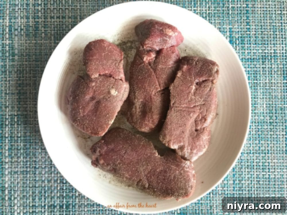 Aromatic Herb Butter Filet Mignon 4 Ingredients for homemade herb butter laid out before mixing, including butter, fresh tarragon, rosemary, and garlic
