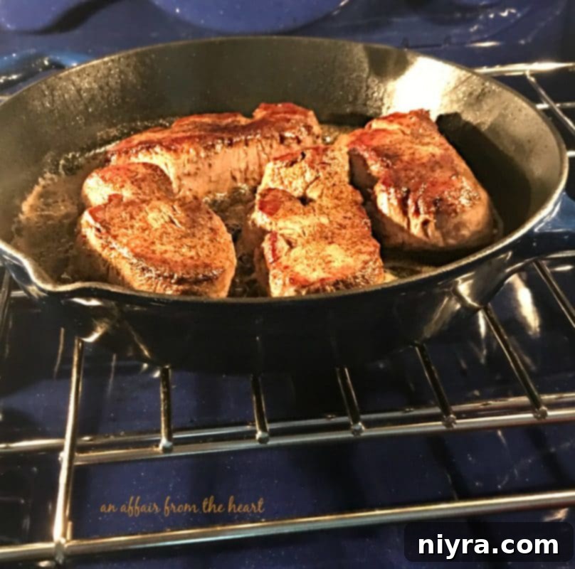 Aromatic Herb Butter Filet Mignon 5 Filet Mignon steaks generously seasoned with salt and pepper, ready for searing