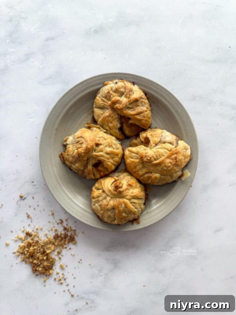 Spiced Rum Caramel Apple Dumplings 15 Plate of apple dumplings with caramel sauce and ice cream