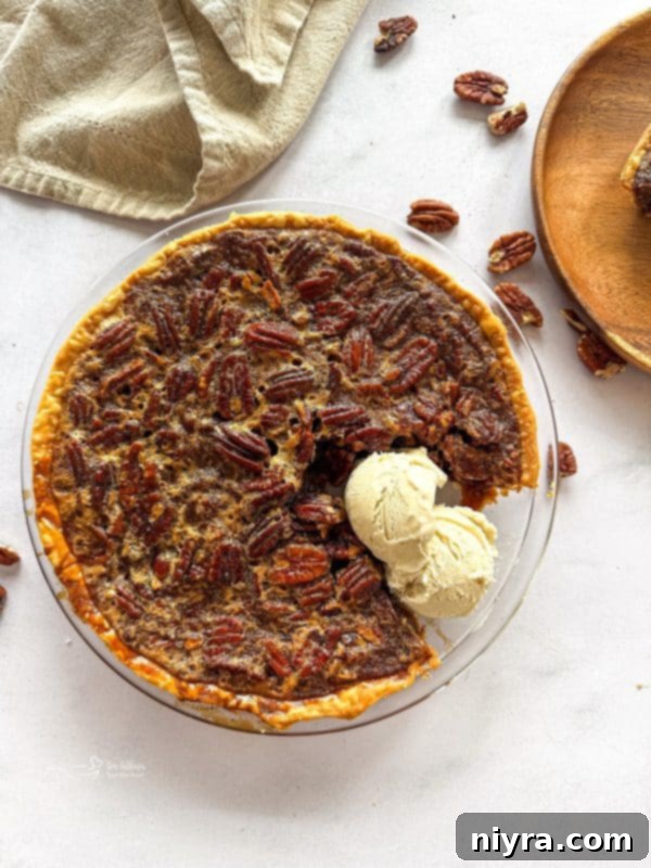 Whole pecan pie on a cutting board