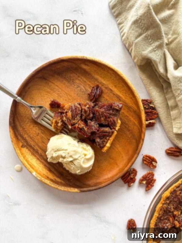 Beautifully sliced pecan pie with a warm, inviting glow, ready to be served.