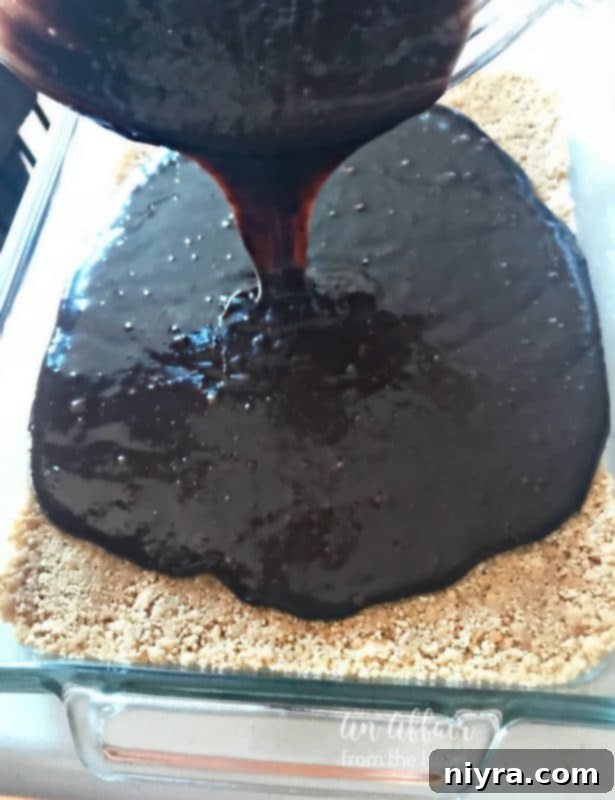 S'mores Brownies 7 Chocolate brownie batter carefully spread over the graham cracker crust in a baking pan