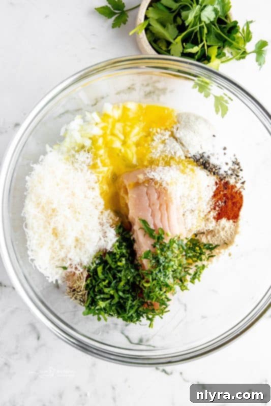 All ingredients for turkey meatballs in a large bowl