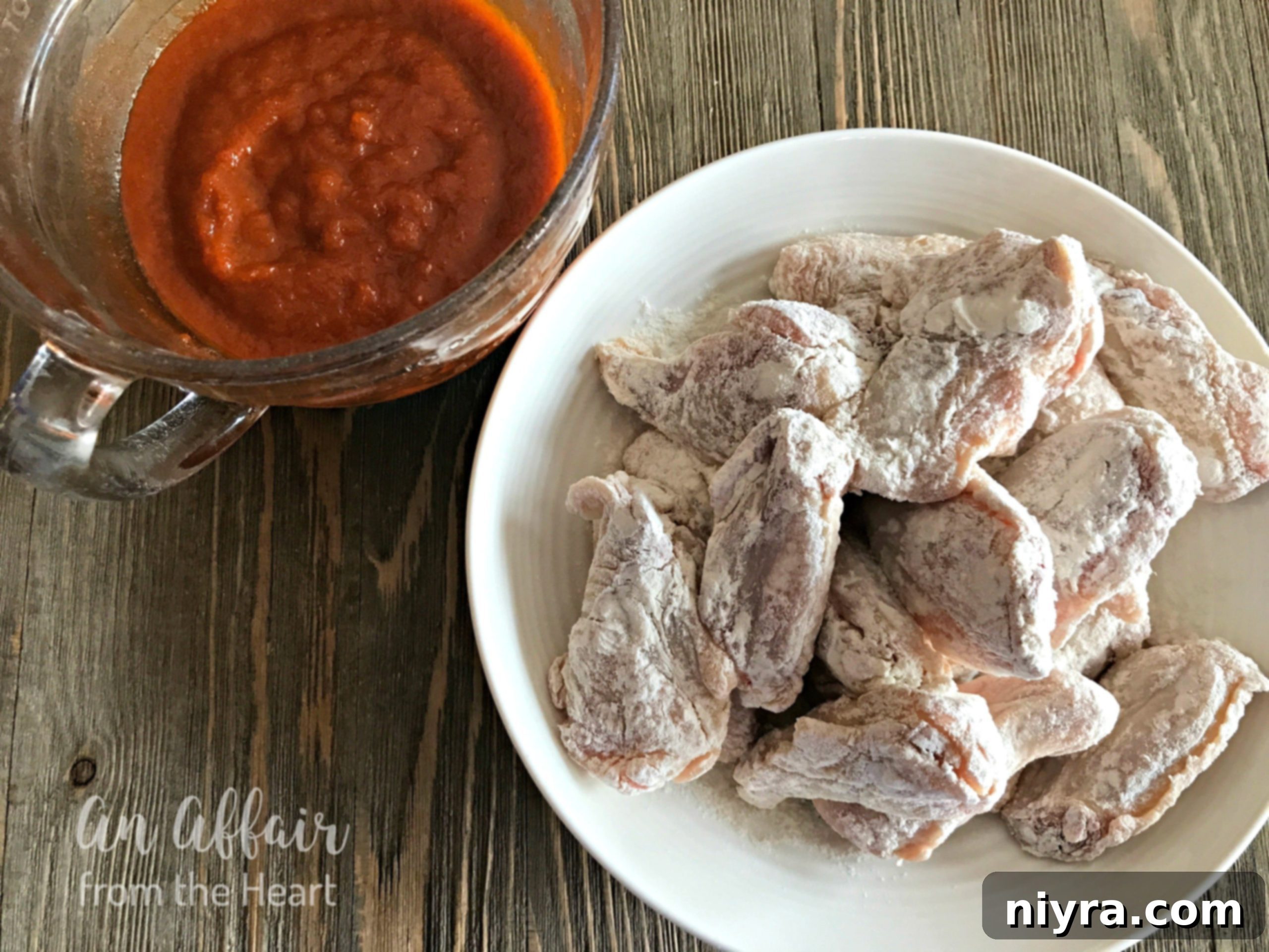 Sticky Honey Sriracha Wings 13 Honey Sriracha Wings - chicken being fried in a pan