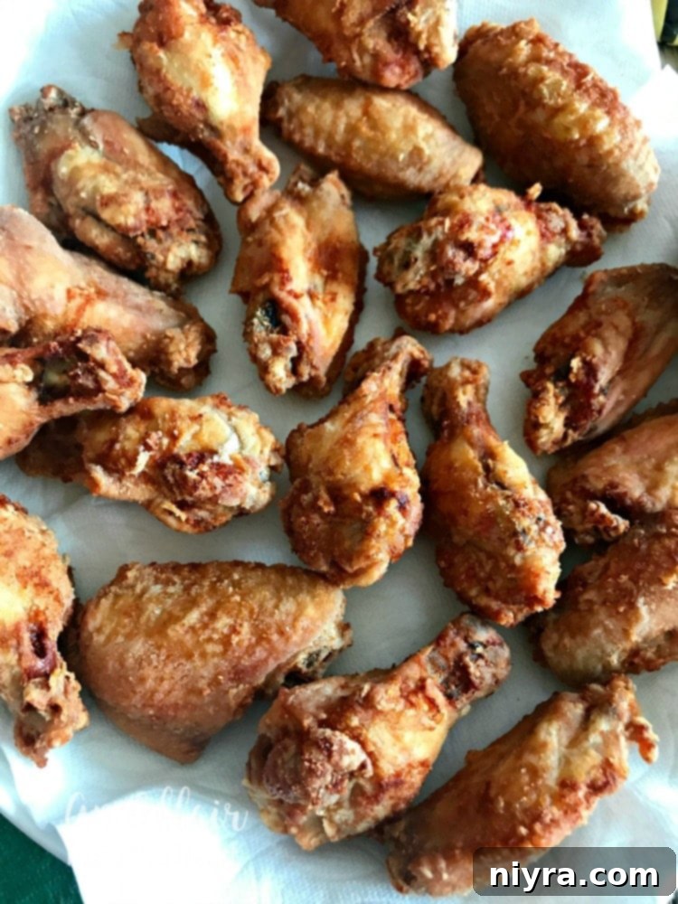 Sticky Honey Sriracha Wings 14 Honey Sriracha Wings - plain fried chicken wings ready for sauce