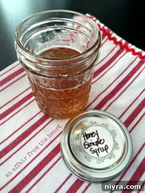 Sticky Honey Sriracha Wings 8 Honey Simple Syrup - a clear, amber liquid in a glass