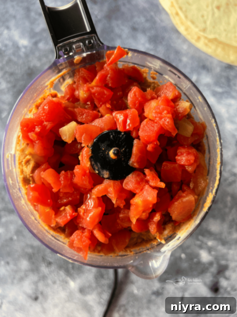 Paisley Farm Five Bean Salad being pureed in a food processor.